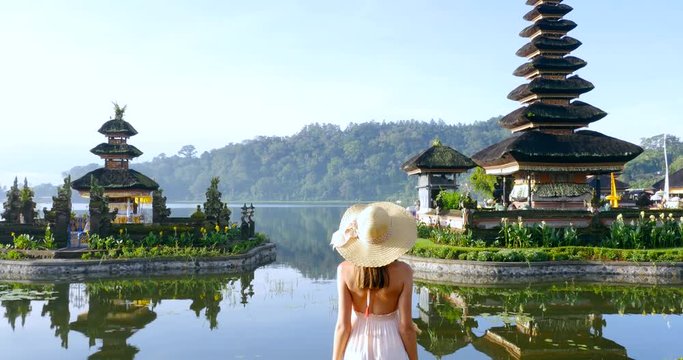 Beautiful girl visiting the ulun danu bratan temple in Bali.