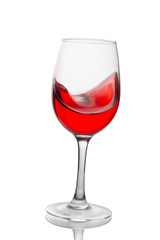 Red wine in a glass isolated on white background. Side view.