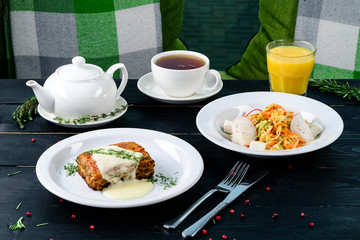 Two plates with the meal on the table, view from above