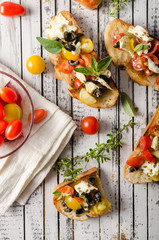 Crostini with tomatoes and olives