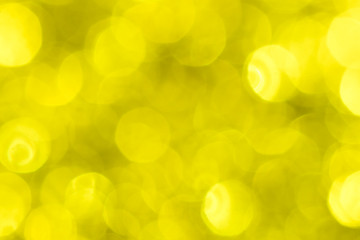 Golden glitter festive background with bokeh lights. Celebration concept for New Year, Christmas Holidays.