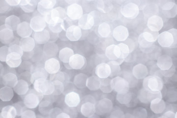 Silver glitter festive background with bokeh lights. Celebration concept for Holidays and anniversary.