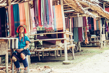 Long Neck Woman wearing at traditional costume. Tribal village Thailand.