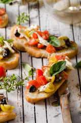 Crostini with tomatoes and olives