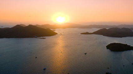 Sunset over the sea with islands. Philippine Islands in the evening aerial view