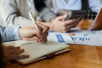 Female staff members are meeting the work summary in the office.
