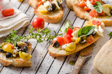 Crostini with tomatoes and olives