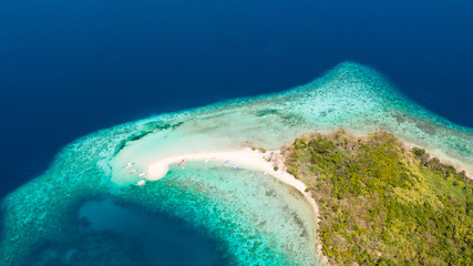 Aerial view tropical beach on island Ditaytayan. tropical island with white sand bar, palm trees and green hills. Travel tropical concept. Palawan, Philippines