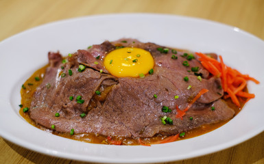 curry rice with roasted beef and raw egg