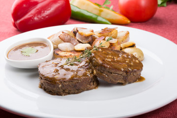 Meat cutlets served with fried potatoes