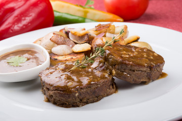 Meat cutlets served with fried potatoes