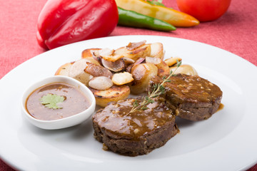 Meat cutlets served with fried potatoes