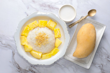 Mango sticky rice is a traditional Thai dessert made with glutinous rice, fresh mango and coconut milk, and eaten with a fork, spoon, or sometimes the hands.