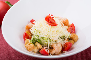 Seafood caesar salad with grilled shrimps