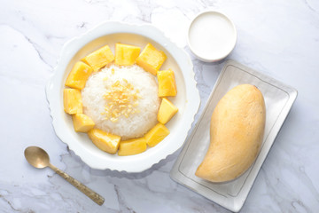 Mango sticky rice is a traditional Thai dessert made with glutinous rice, fresh mango and coconut milk, and eaten with a fork, spoon, or sometimes the hands.