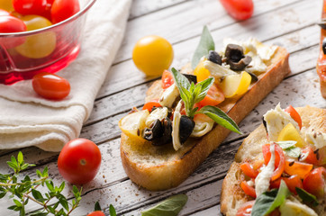 Crostini with tomatoes and olives