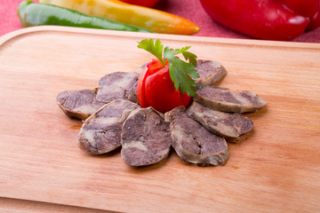 Rustic raw smoked meat sliced on chopping board
