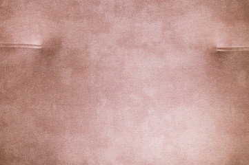 Fototapeta premium A close-up of a fragment of an expensive beige textile sofa in the room