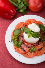Buffalo burrata cheese served with fresh raw tomatoes