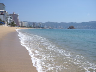 Scenic skyscrapers in ACAPULCO city in Mexico with luxury hotels buildings at bay of Pacific Ocean
