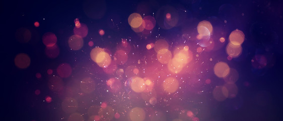 abstract glitter lights background. red, black, purple and gold. de-focused. banner