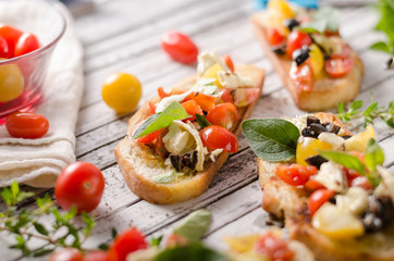 Crostini with tomatoes and olives