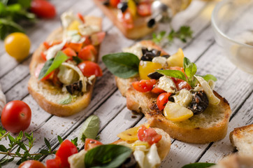 Crostini with tomatoes and olives