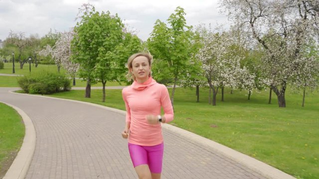 Runner - woman running outdoors, training, weight loss concept.