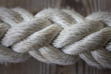 rope fragment on wooden background