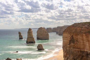 Scenic view alongside the Great Ocean Road in Australia including the Twelve Apostles limestone stack formations.