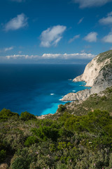 Fototapeta na wymiar Cliffs above clear turquoise waters of Shipwreck Cove