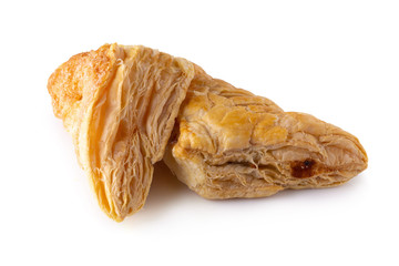 Puff pastry buns isolated over white background.