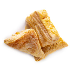 Puff pastry buns isolated over white background.