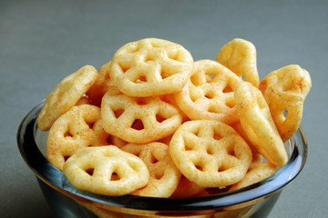 Tasty and crunchy snacks for kids, in a glass bowl