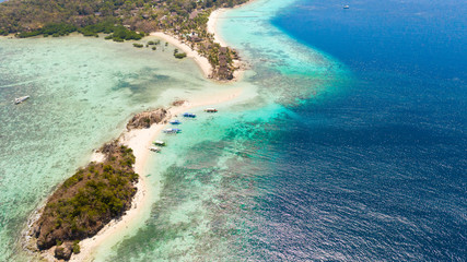 Tropical islands with white beaches. Turquoise lagoon and coral reefs, top view. Philippines, Palawan