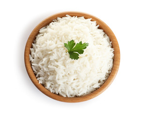 Bowl of tasty cooked rice with parsley on white background, top view