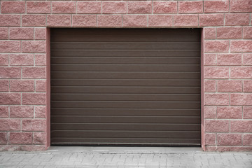 Closed roller shutter door of modern garage