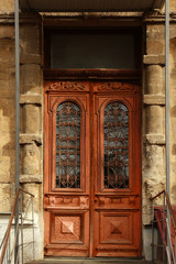 Closed vintage wooden door in old building