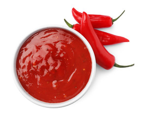 Bowl with red sauce and fresh chili peppers isolated on white, top view