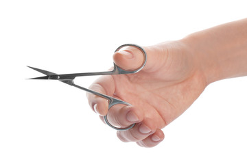 Woman holding nail scissors on white background, closeup