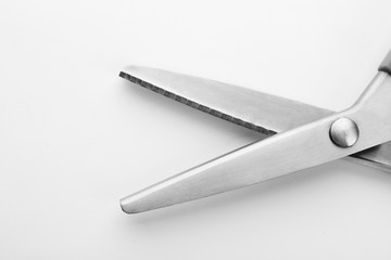 Pair of sewing scissors on white background, closeup