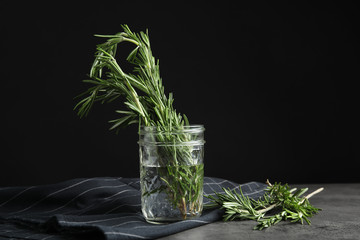 Fresh green rosemary in jar on table, space for text - Powered by Adobe