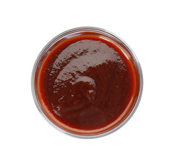 Glass bowl of barbecue sauce on white background, top view