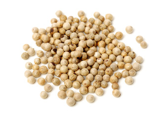 White peppercorns on white background