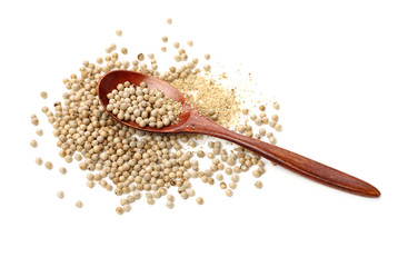 White peppercorns on white background