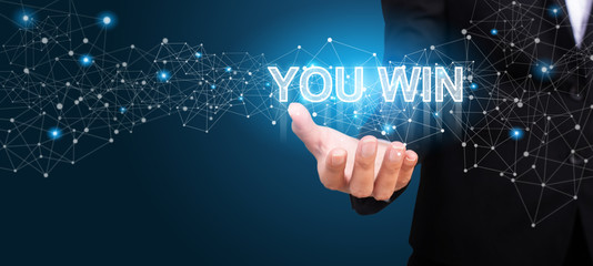 you win in the hand of business. you win concept
