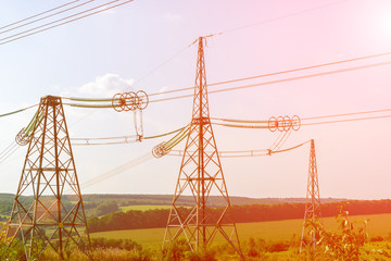 metal power line poles with wires. Electricity transmission concept