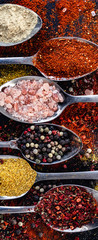 Spoons in raw with indian spices scattered on background table, peppercorn paprika salt turmeric powder, red yellow and pink herbs seasoning top view, horizontal banner header for website design