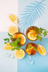 Iced tea with lemon slices, mint and ice