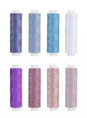 Set of sewing thread coils, miscellaneous colours, isolated on white